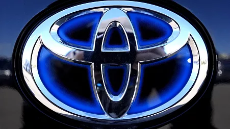 Scandal-hit car maker Toyota sees profits take a tumble